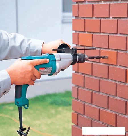 Ударная дрель Makita HP 2051