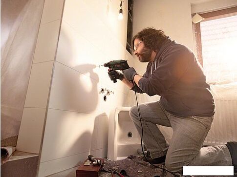 Ударная дрель Bosch UniversalImpact 700 [0603131020]